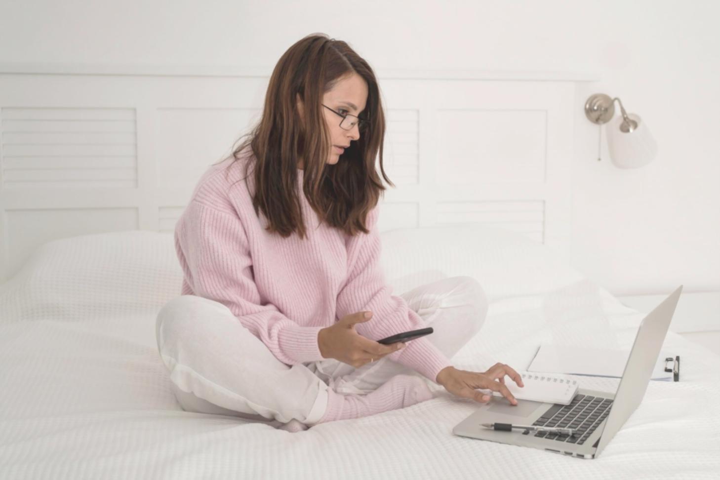 Financial analyst reviewing comprehensive investment tracking spreadsheet with multiple asset classes